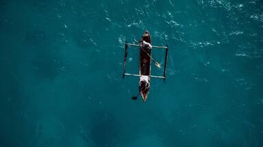 Traditional canoe paddling in Mozambique