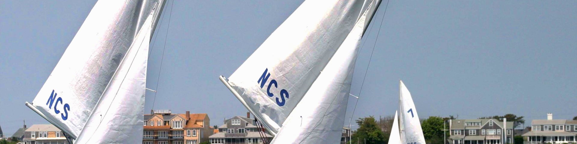 Nantucket which includes a sporting event, sailing and a coastal town