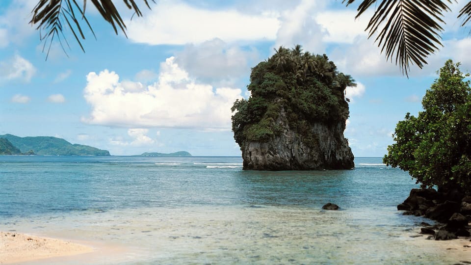 Futi Rock in the ocean near Fatumafuti on Tutuila Island, a part of American Samoa, a group of islands in the southern Pacific Ocean area.