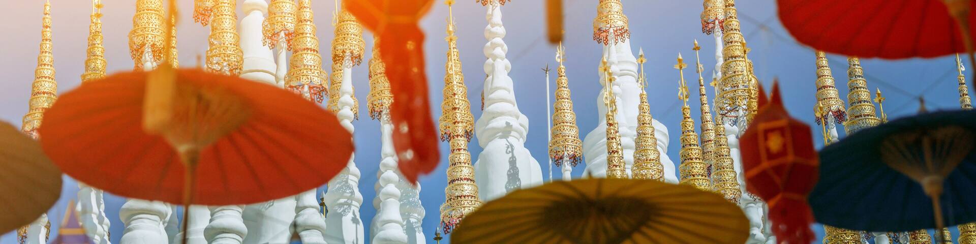 Phrae, Thailand. The top of the white pagoda of Wat Pong Sunan Temple in the light of the sun