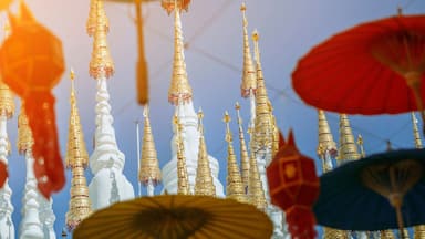 Phrae, Thailand. The top of the white pagoda of Wat Pong Sunan Temple in the light of the sun