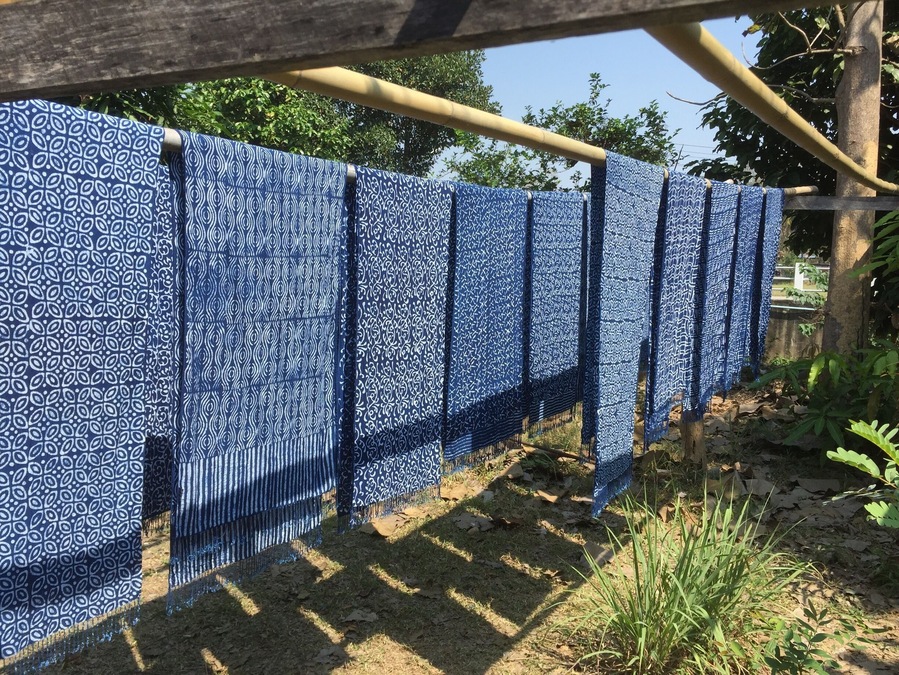 We visited a shop that still uses the process to make indigo. Then, they use beautiful batik designs and dye the fabric.
