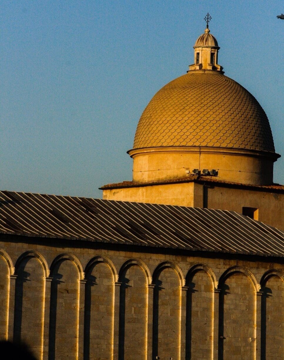 The Campo Santo, also known as Camposanto Monumentale ("monumental cemetery") or Camposanto Vecchio ("old cemetery"), is a historical edifice at the northern edge of the Cathedral Square in Pisa, Italy.
"Campo Santo" can be literally translated as "holy field", because it is said to have been built around a shipload of sacred soil from Golgotha, brought back to Pisa from the Fourth Crusade by Ubaldo de' Lanfranchi, archbishop of Pisa in the 12th century. A legend claims that bodies buried in that ground will rot in just 24 hours. The burial ground lies over the ruins of the old baptistery of the church of Santa Reparata, the church that once stood where the cathedral now stands. The term "monumental" serves to differentiate it from the later-established urban cemetery in Pisa. #architecture #stunningstructures