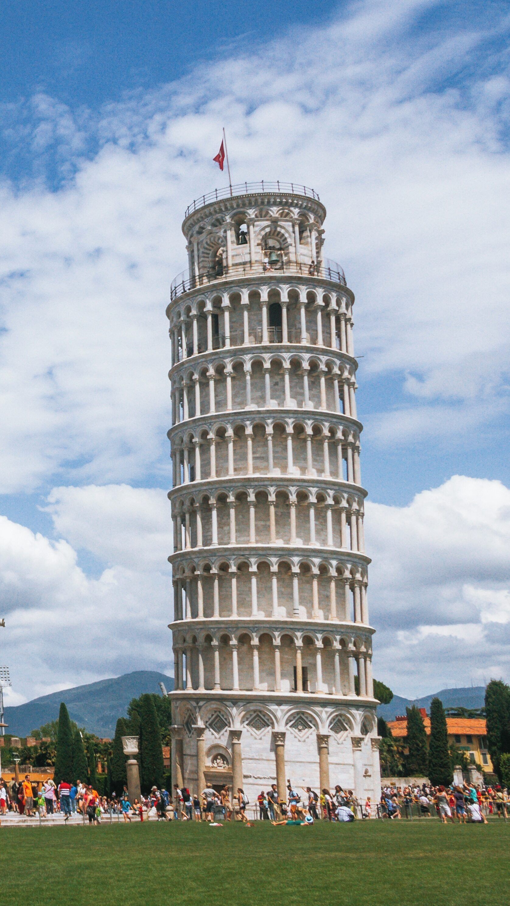 Leaning Tower stands tall amidst the bustling city center of Pisa, Tuscany, inviting visitors to marvel at its architectural wonder and historical significance