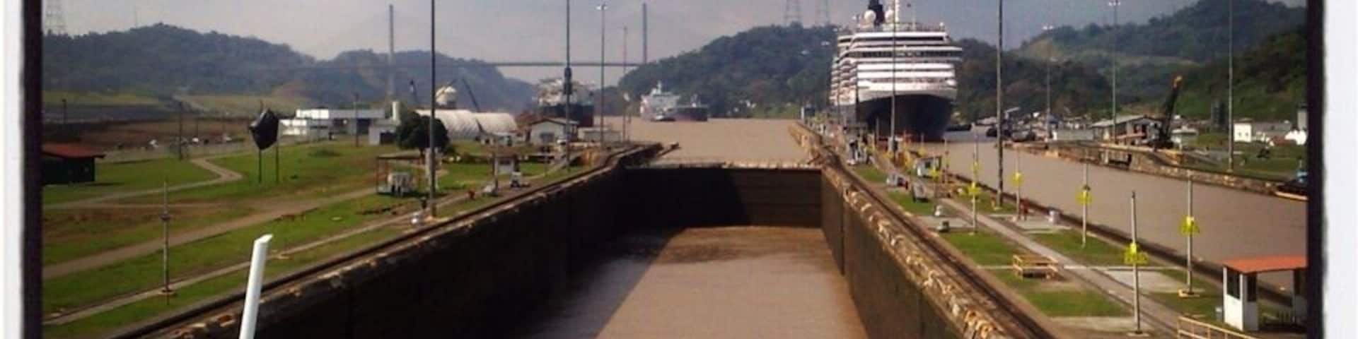 Panama Canal - One of my experience about the locks and passages that connects Atlantic ocean to Pacific ocean. There are locks at each end to lift ships up to above sea-level. (As seen farther was the Queen Mary ship).