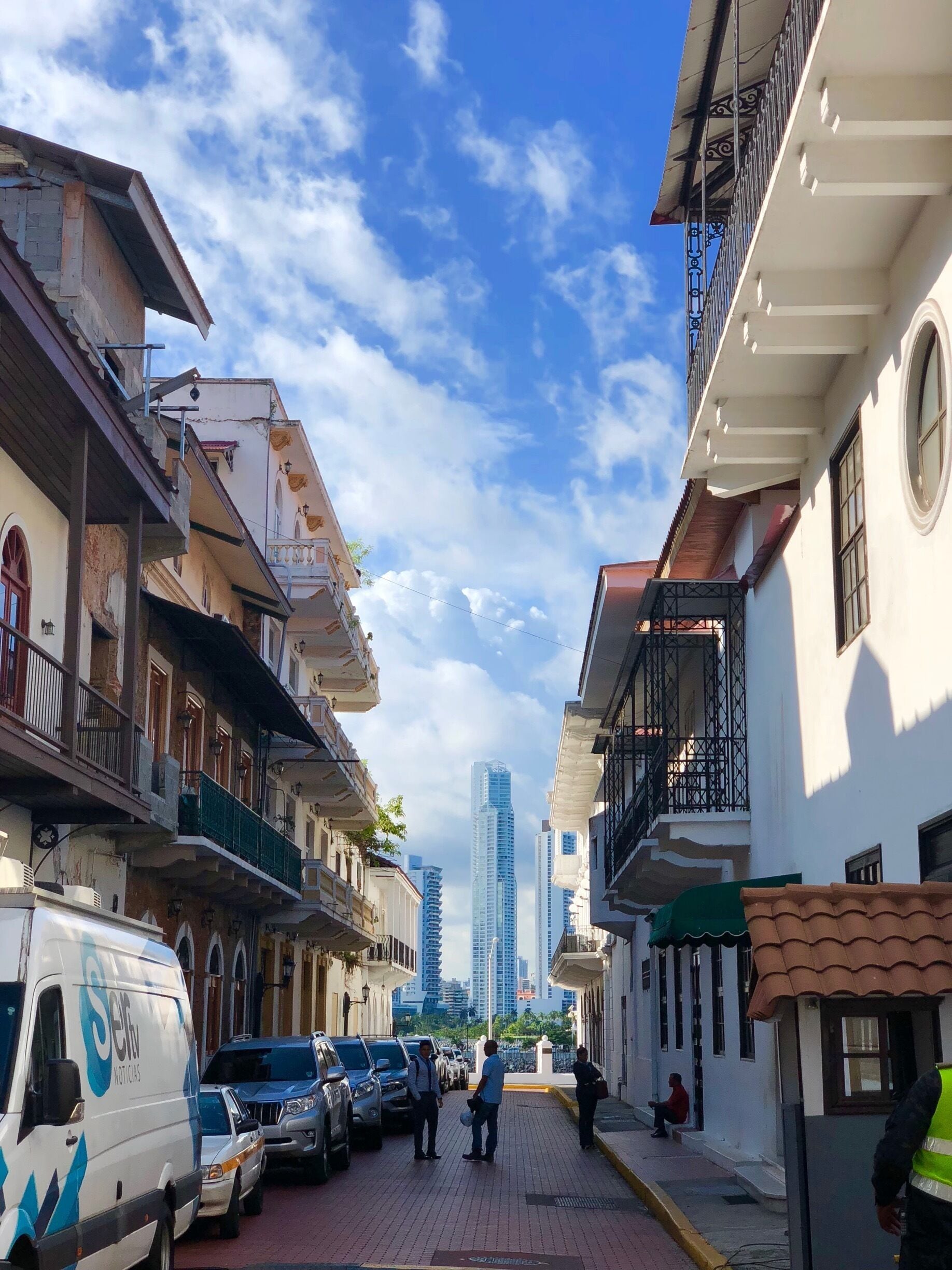 A good contrast, modern high rise behind and colonial houses in front 