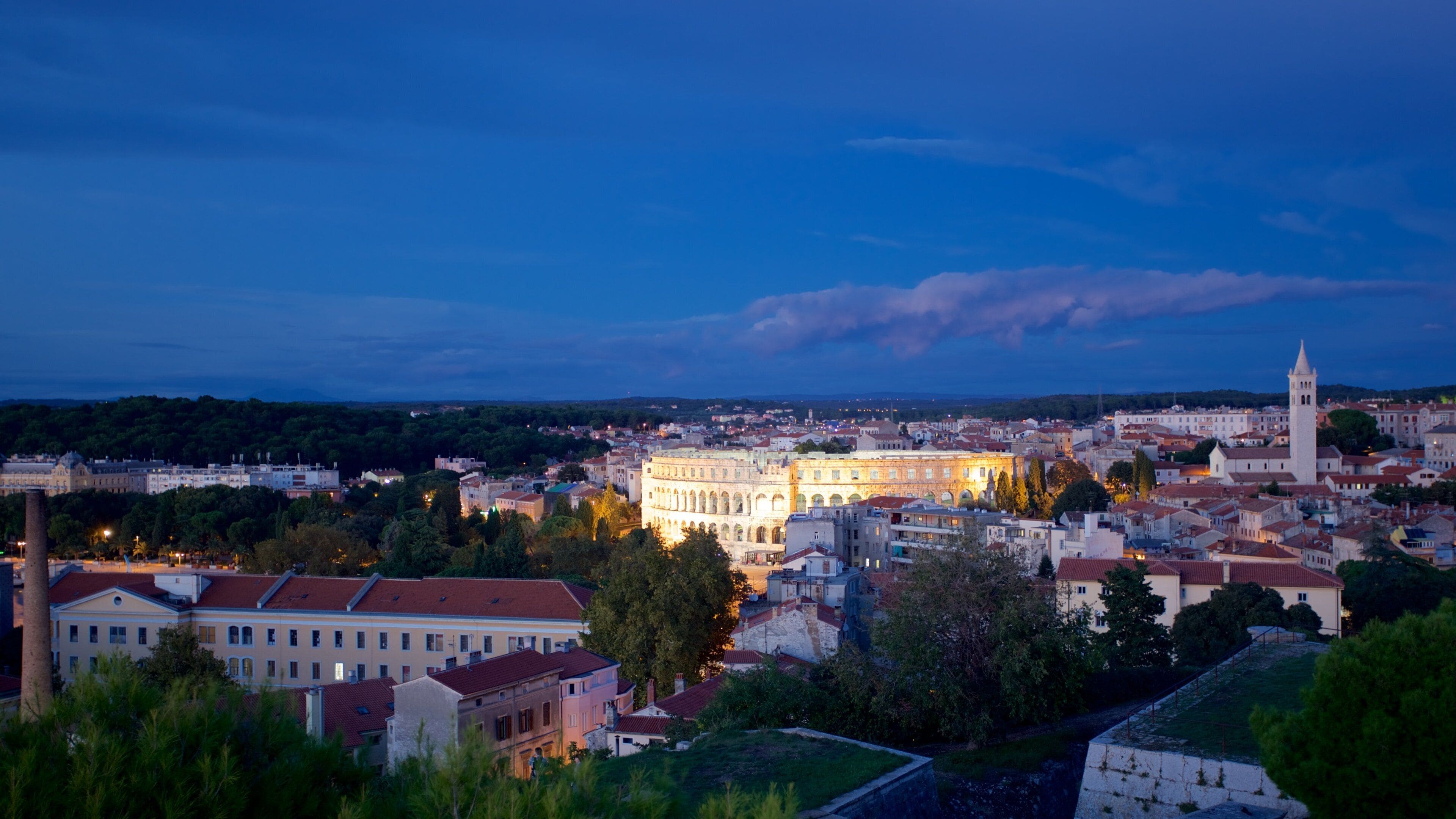 Pula which includes a city and night scenes