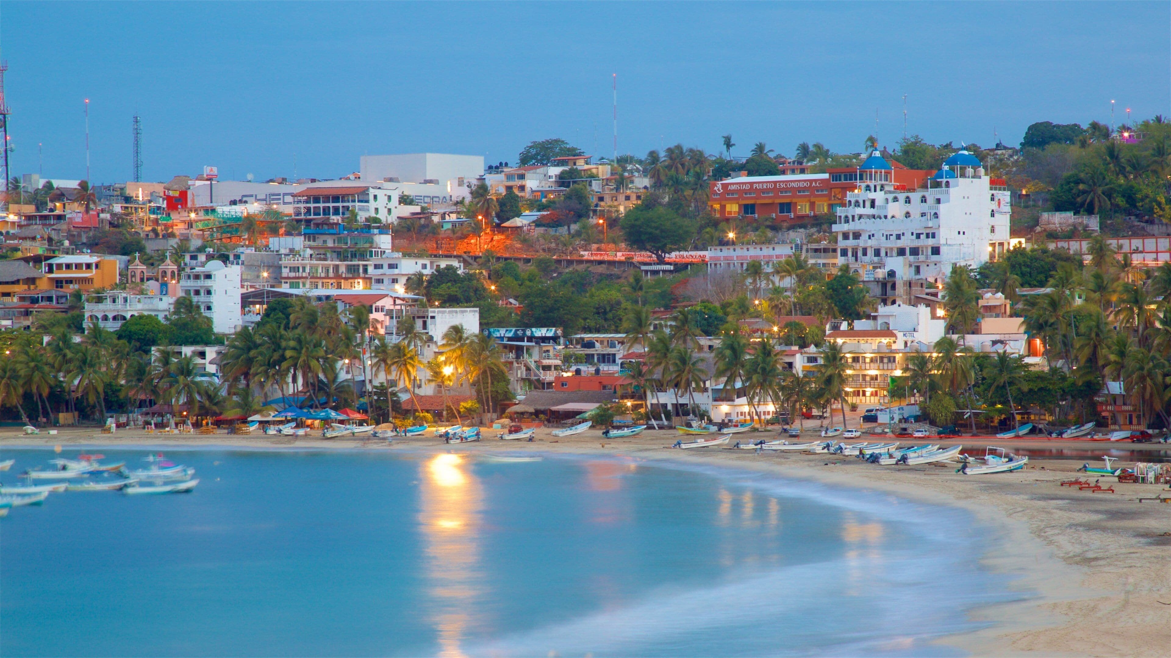 Puerto Escondido showing landscape views, a coastal town and boating