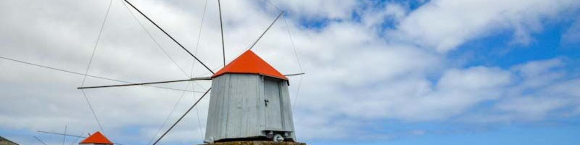 Three preserved windmills standing proud on Porto Santo Island.