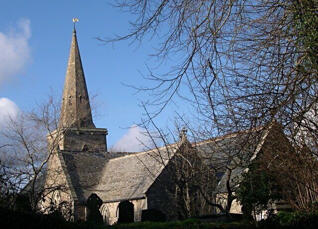 A historic church with a tall steeple and a pointed roof.