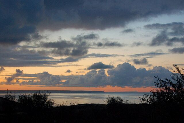 Clouds over Mount's Bay at 5am on a September morning The sun had not yet risen when I took this shot, looking out across Mount's Bay to the Lizard peninsula. The clouds look quite stormy here, but some hours afterwards they all dispersed, to reveal a clear sky and make a lovely crisp autumnal morning.