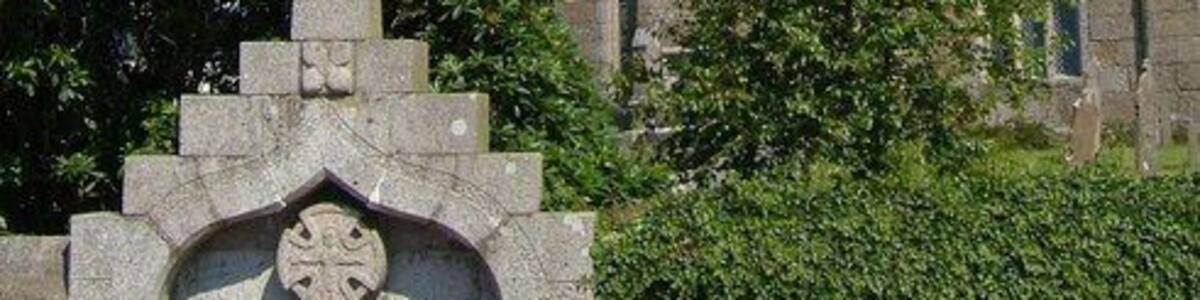 Church of St Buryan "North wall of chancel is C12, otherwise C15 and possibly early C16 ... Largely unaltered late medieval exterior, with most of the original openings ... Tall C15 4-storey embattled tower has buttresses set back from the corners; strings dividing the stages" http://www.imagesofengland.org.uk/details/default.aspx?id=69682 In the foreground is the WW1 war memorial, a "large ogee-headed arched niche containing a pierced wheel-headed cross" http://www.imagesofengland.org.uk/Details/Default.aspx?id=69697&mode=adv . The circular churchyard probably indicates pre-Christian origin, in this case "the enclosure wall of a late Iron Age enclosed settlement".