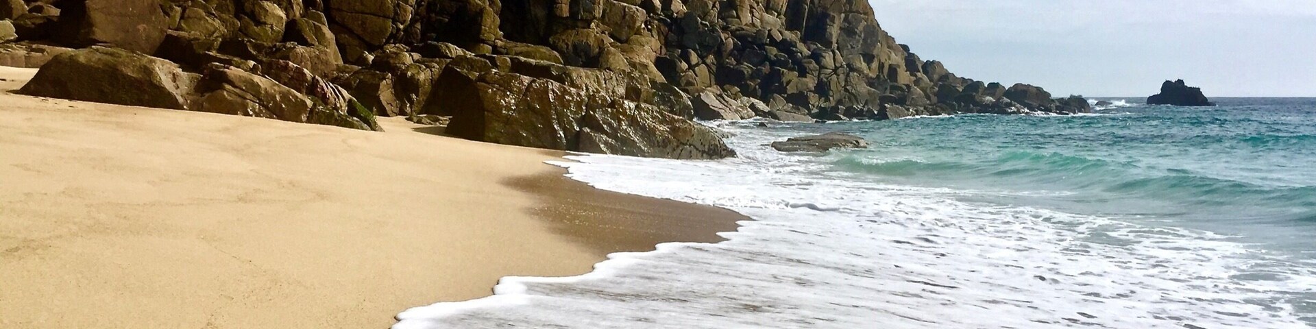 The immaculate sand, sea and granite of Porthchapel Cove, reached only by a difficult rocky descent which has claimed many victims!