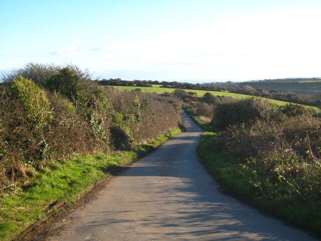 Minor road south of Carfury With a distant view of the sea in Mount's Bay.
