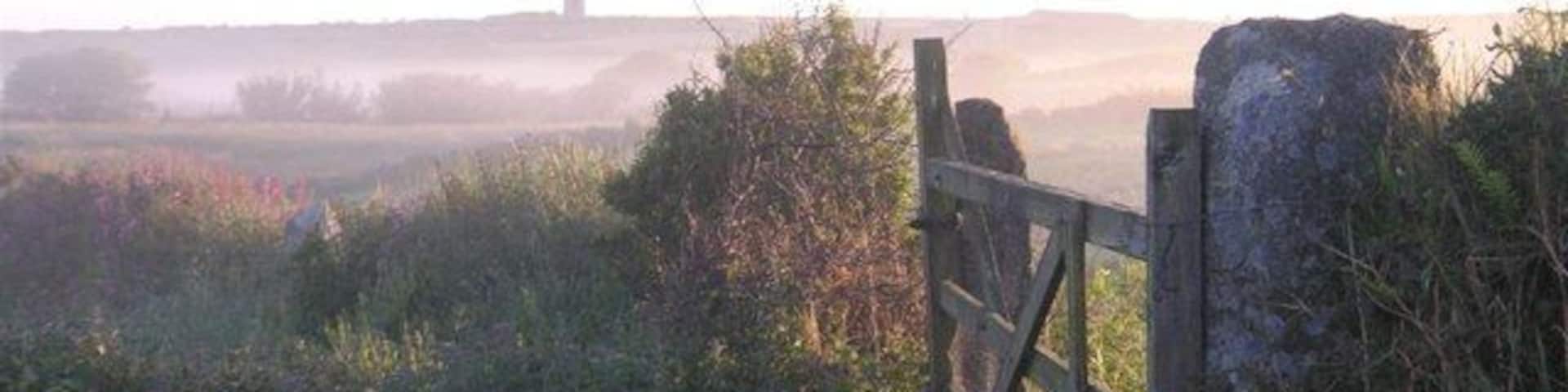 Ding Dong at sunrise The Greenburrow stack of the Ding Dong mine on the horizon, at sunrise on a June morning.