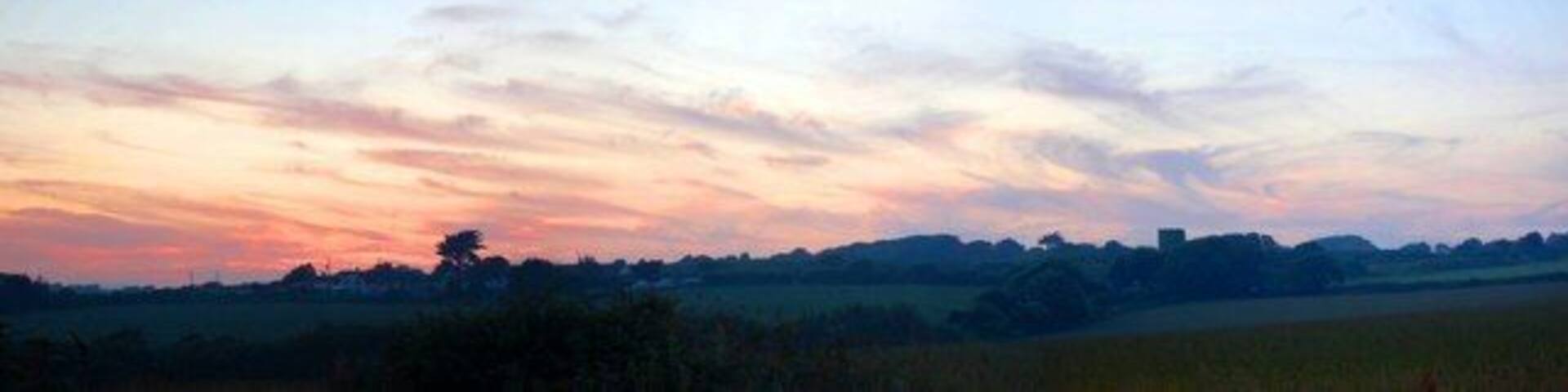 Sunset over Rosudgeon I took this photo whilst out walking my dogs towards from Kenneggy towards Rosudgeon Common, down the back lane. Minutes later the orange glow had changed to a pale blue hue, but it was captured forever for all to see !