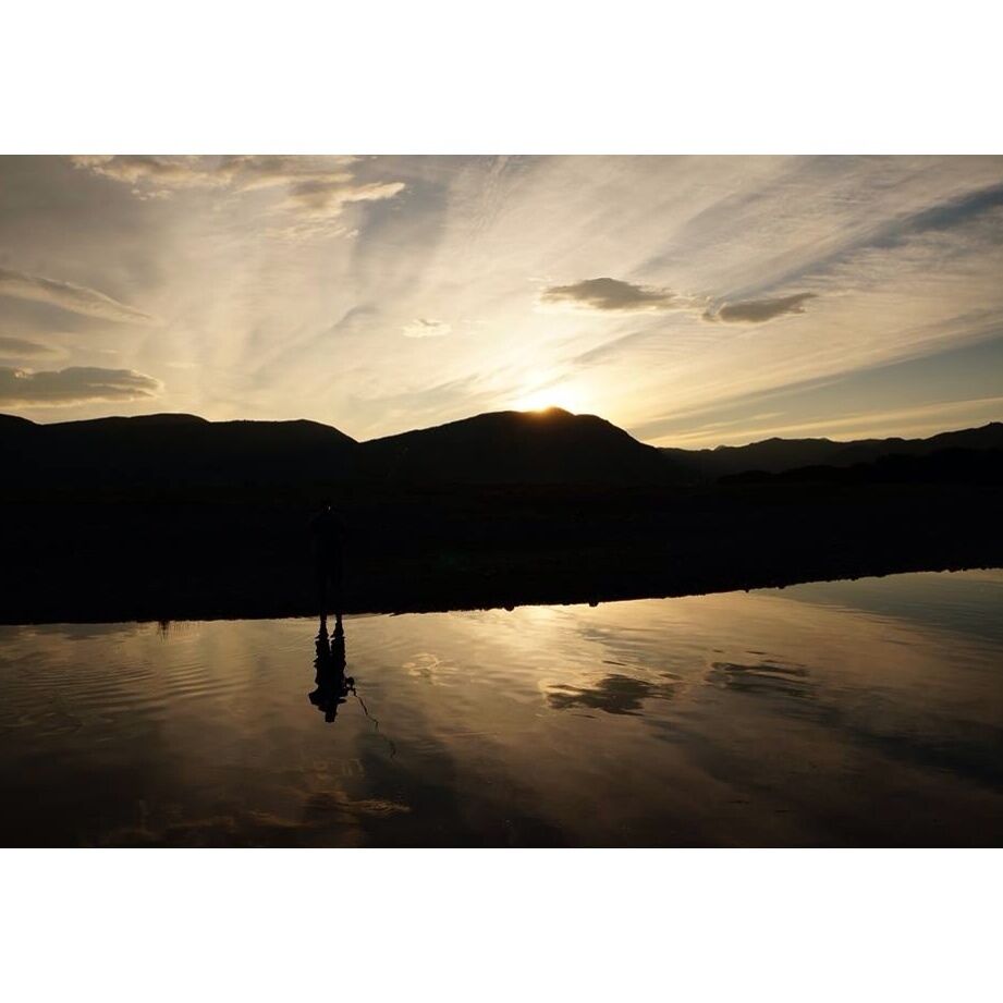Fisherman looking for red salmon late at the river