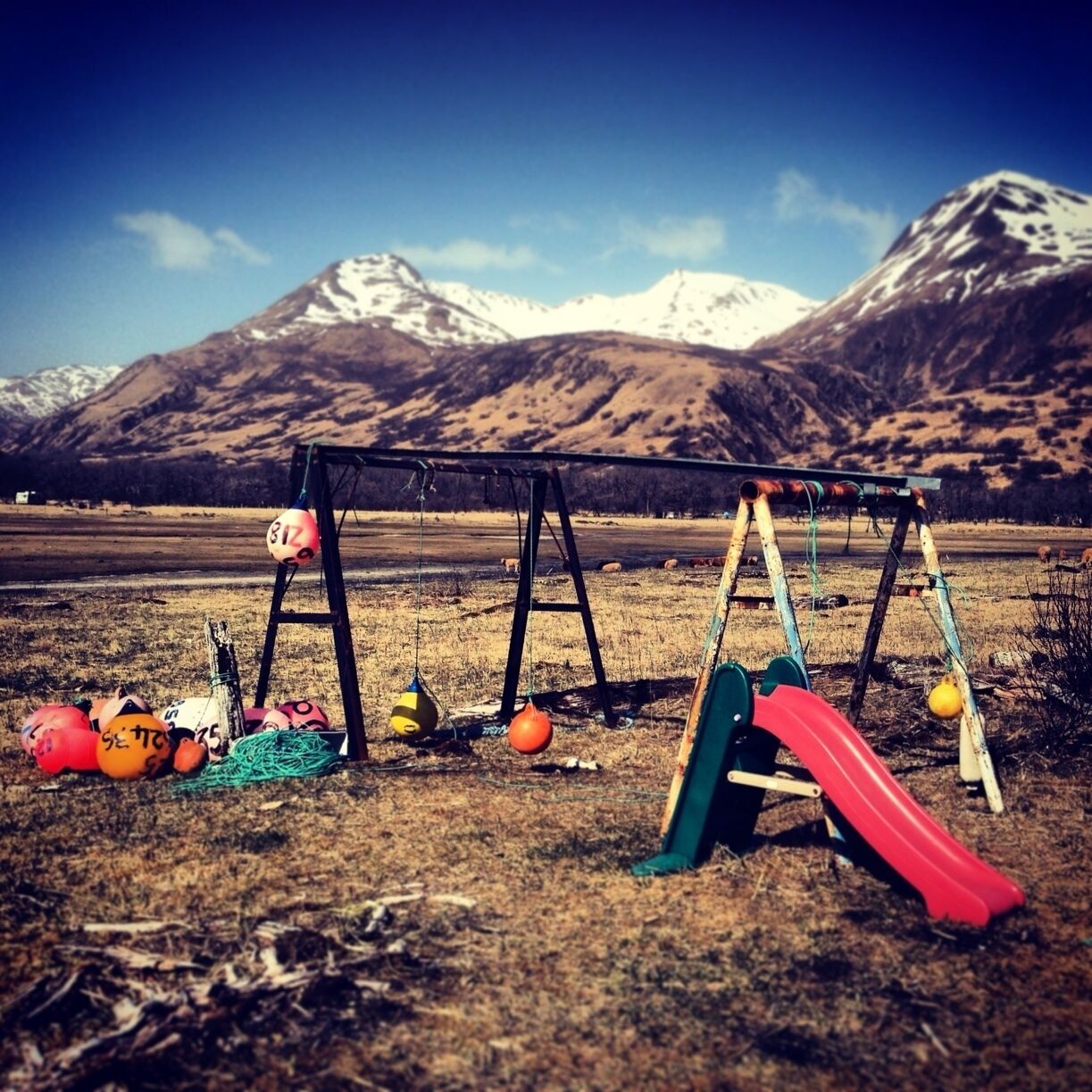 A child's play set with fishing buoys at Kalsin Beach