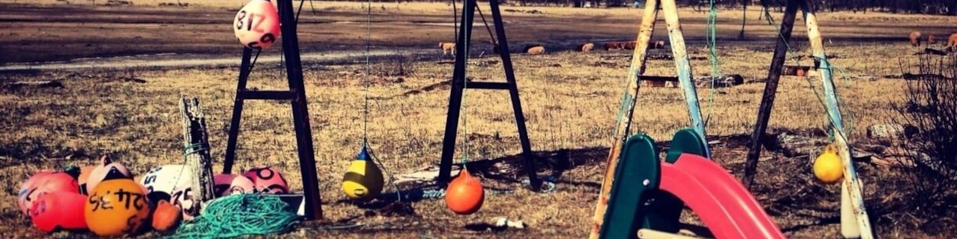 A child's play set with fishing buoys at Kalsin Beach