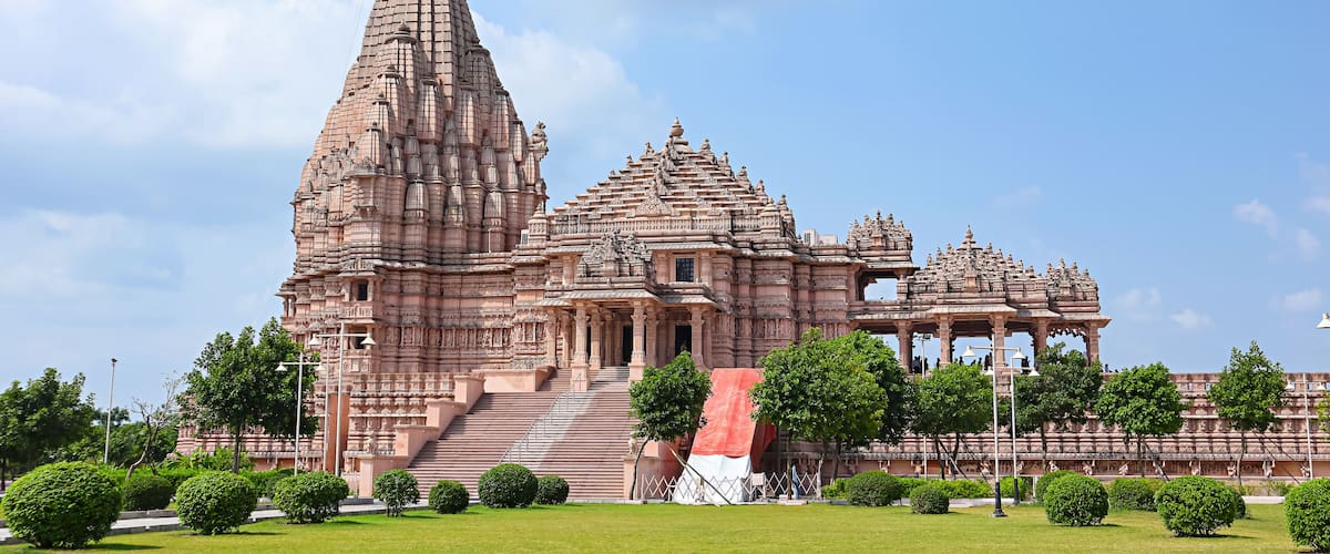 View of the newly built Shree Khondaldham Temple with carved sculptures of Hindu deities, Kagvad, Rajkot, Gujarat, India.
