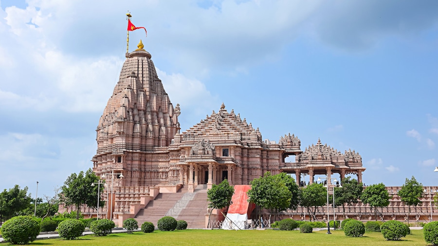 View of the newly built Shree Khondaldham Temple with carved sculptures of Hindu deities, Kagvad, Rajkot, Gujarat, India.