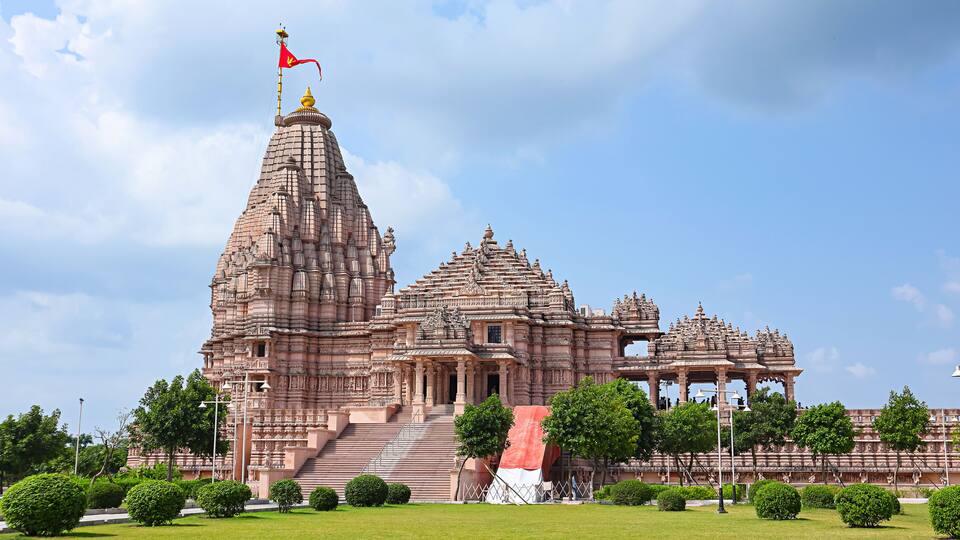 View of the newly built Shree Khondaldham Temple with carved sculptures of Hindu deities, Kagvad, Rajkot, Gujarat, India.