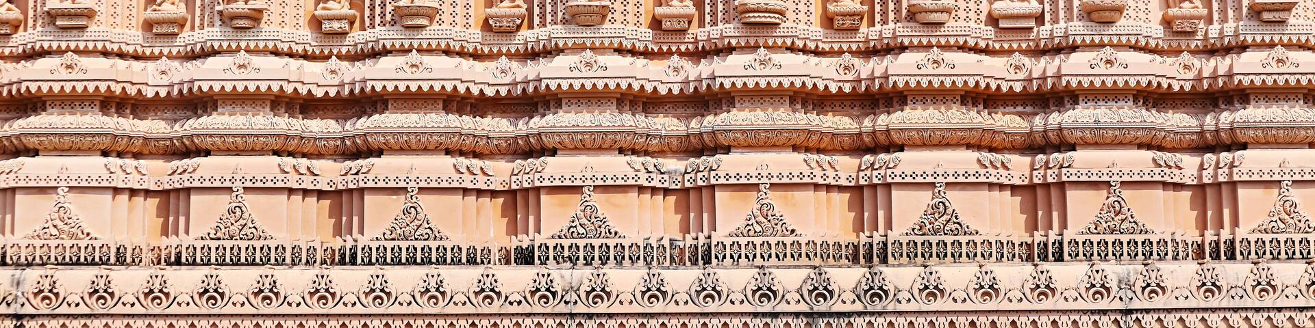 Carved sculptures of Hindu deities on Shree Khondaldham Temple, Kagvad, Rajkot, Gujarat, India.