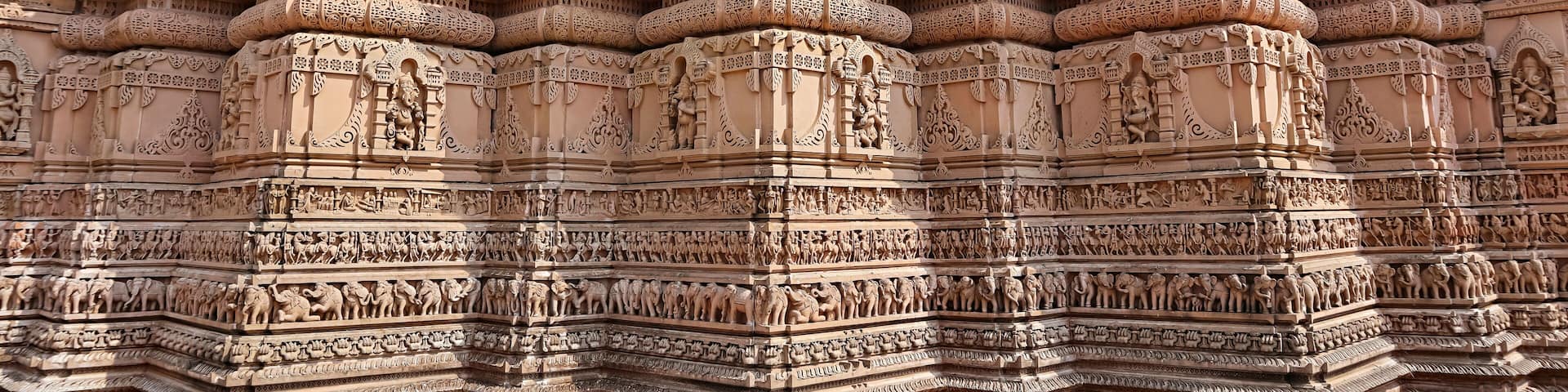 Beautiful carving sculptures of Hindu deities and animals on Shree Khondaldham Temple, Kagvad, Rajkot, Gujarat, India.