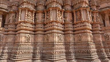 Beautiful carving sculptures of Hindu deities and animals on Shree Khondaldham Temple, Kagvad, Rajkot, Gujarat, India.