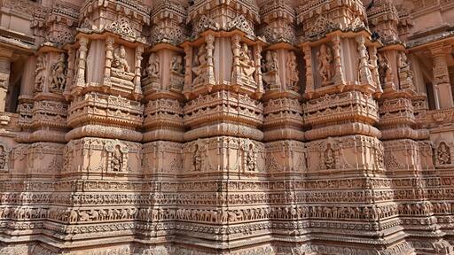 Beautiful carving sculptures of Hindu deities and animals on Shree Khondaldham Temple, Kagvad, Rajkot, Gujarat, India.