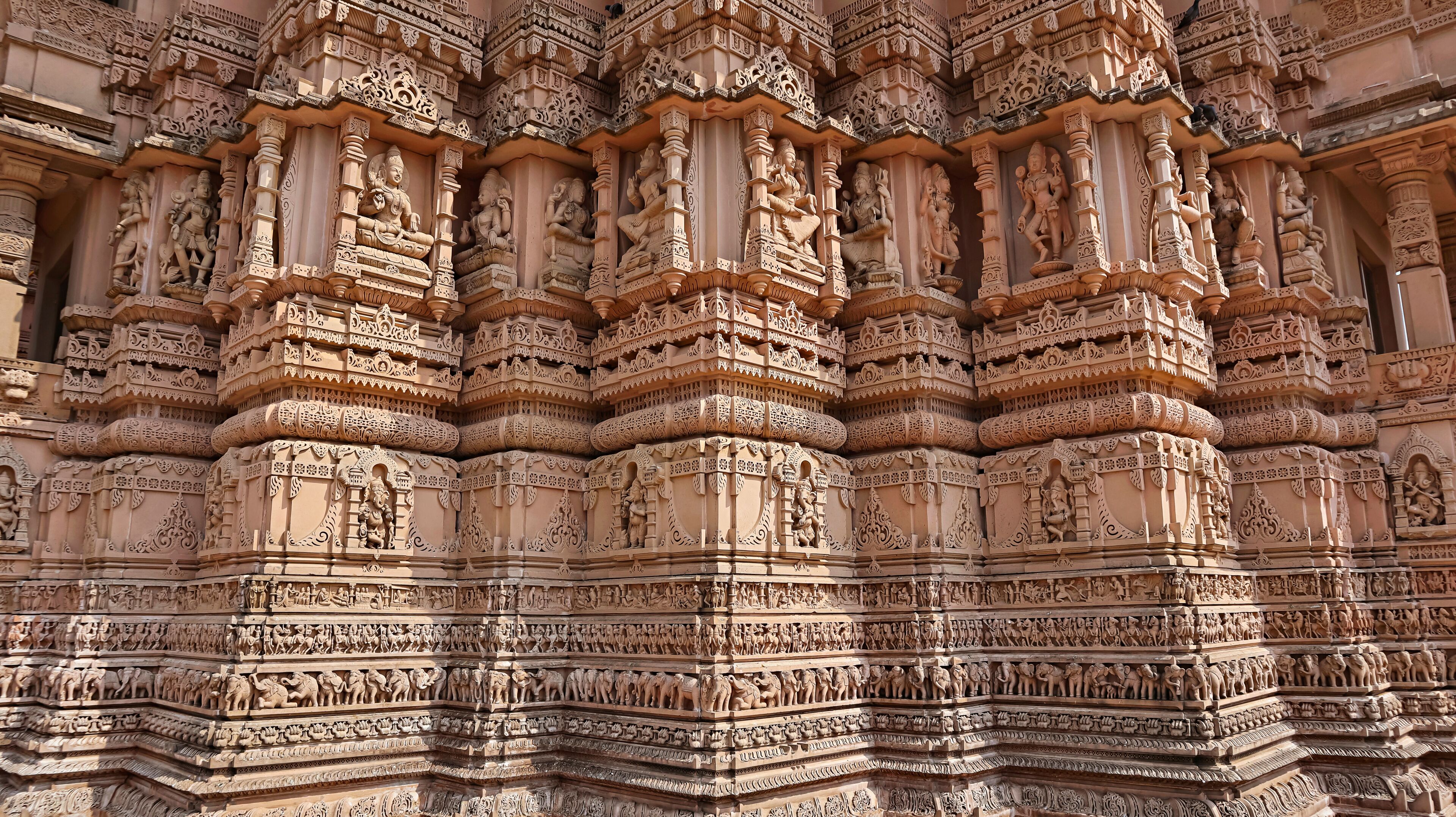Intricate carvings and sculptures on a temple's facade.