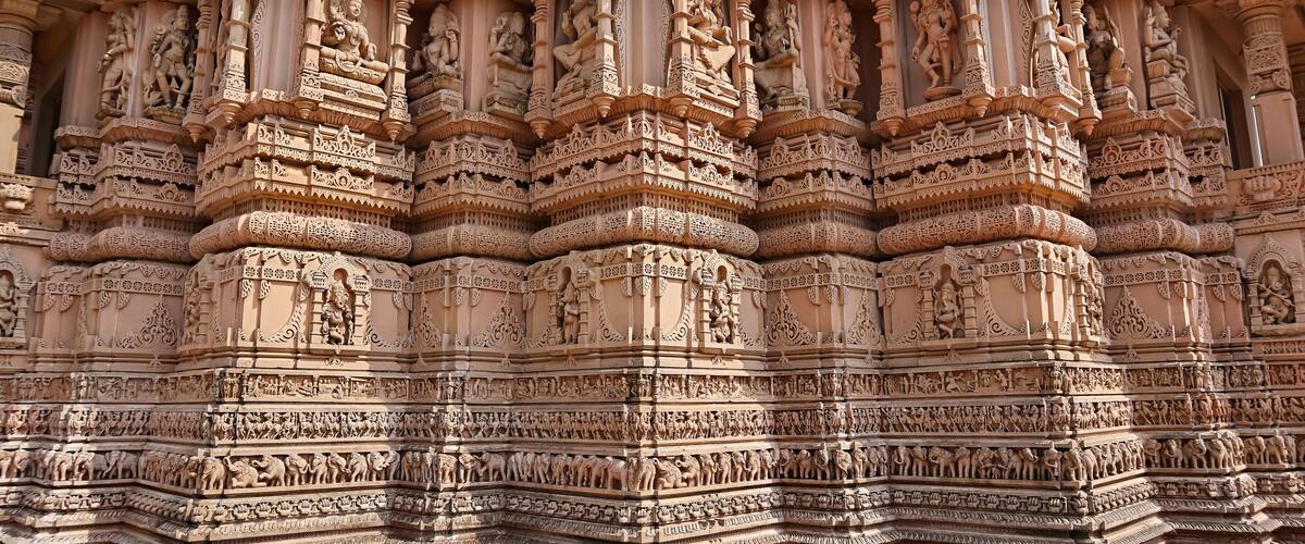 Intricate carvings and sculptures on a temple's facade.