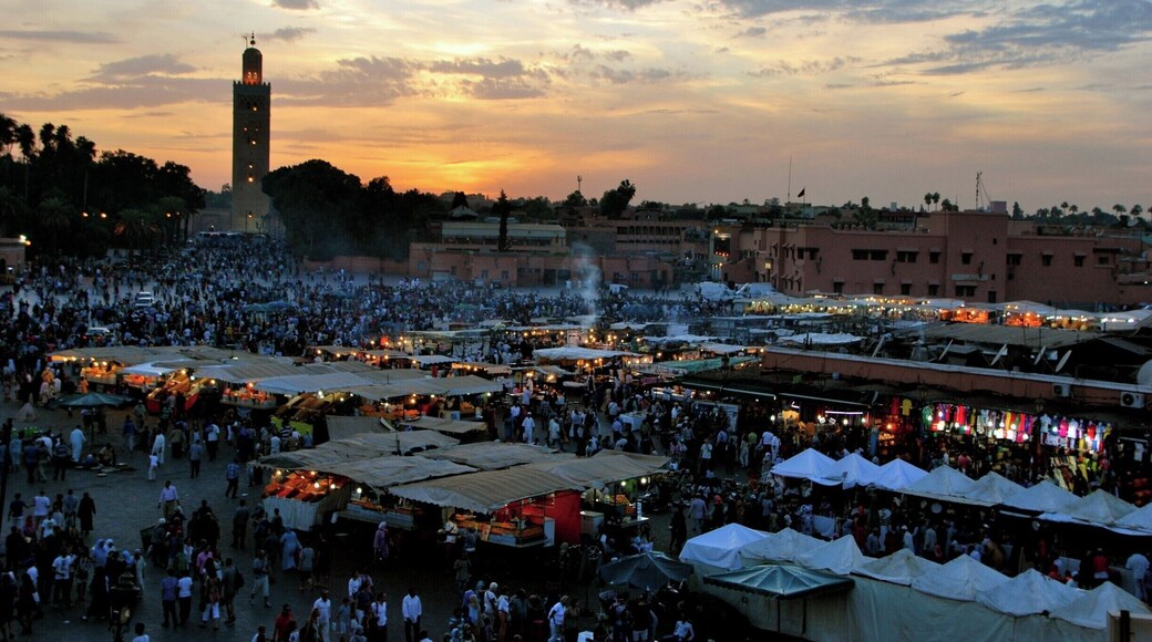 Jemaa el-Fnaa square_
Marrakech is a major city in the northwest African nation of Morocco. It is the fourth largest city in the country after Casablanca, Rabat and Fes, and is the capital of the mid-southwestern region of Marrakesh-Tensift-El Haouz. Marrakesh is possibly the most important of Morocco's four former imperial cities (cities that were built by Moroccan Berber empires). The red walls of the city have given the city the nickname of the "Red City". Marrakesh grew rapidly and established itself as a cultural, religious, and trading centre for the Maghreb and sub-Saharan Africa; Jemaa el-Fnaa is the busiest square in Africa.
