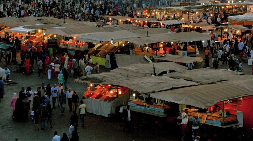 Jemaa el-Fnaa square_
Marrakech is a major city in the northwest African nation of Morocco. It is the fourth largest city in the country after Casablanca, Rabat and Fes, and is the capital of the mid-southwestern region of Marrakesh-Tensift-El Haouz. Marrakesh is possibly the most important of Morocco's four former imperial cities (cities that were built by Moroccan Berber empires). The red walls of the city have given the city the nickname of the "Red City". Marrakesh grew rapidly and established itself as a cultural, religious, and trading centre for the Maghreb and sub-Saharan Africa; Jemaa el-Fnaa is the busiest square in Africa.