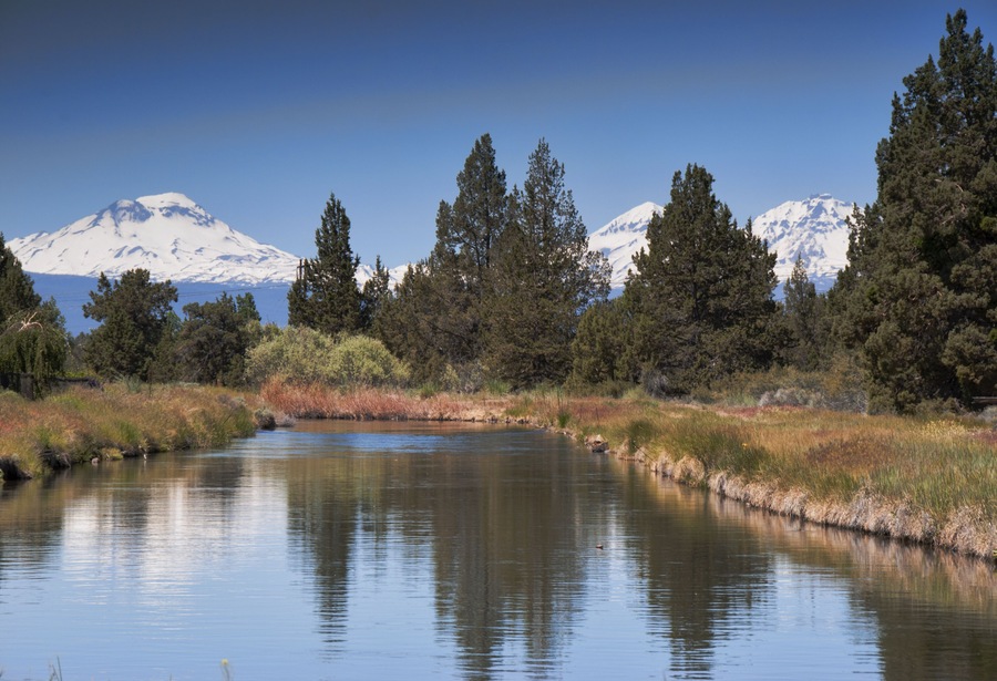 Three Sisters Mountain. View from Redmond, Oregon. River in foreground leading to mountains in the distant.; Shutterstock ID 197274512; Purchase Order: -
