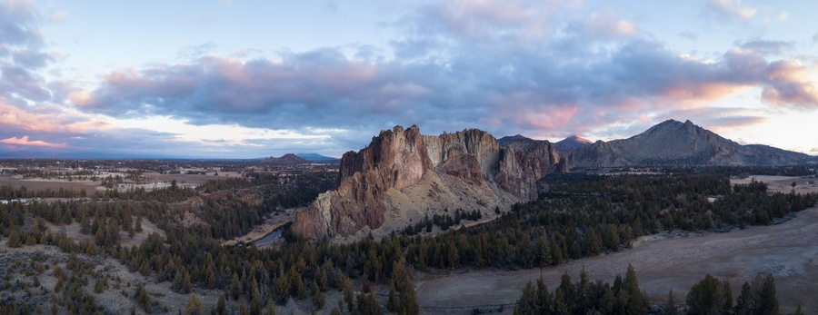 Aerial panoramic view of a beautiful landmark, Smith Rock, famous for rockclimbing. Taken in Redmond, Oregon, America, during a vibrant sunrise.