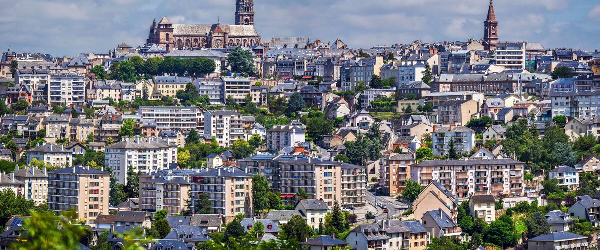 A densely populated urban area with historic buildings and modern high-rises.