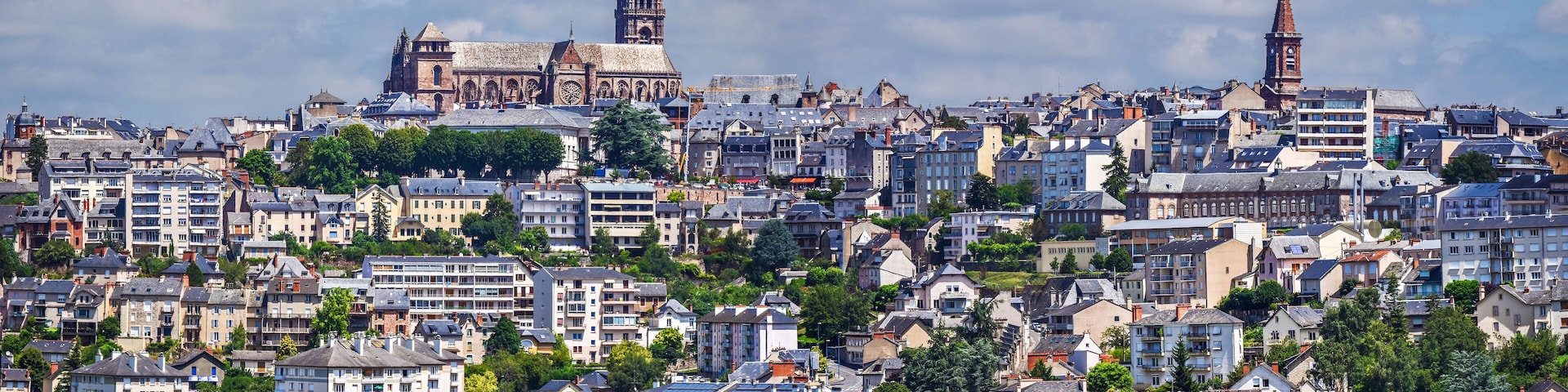 A densely populated urban area with historic buildings and modern high-rises.