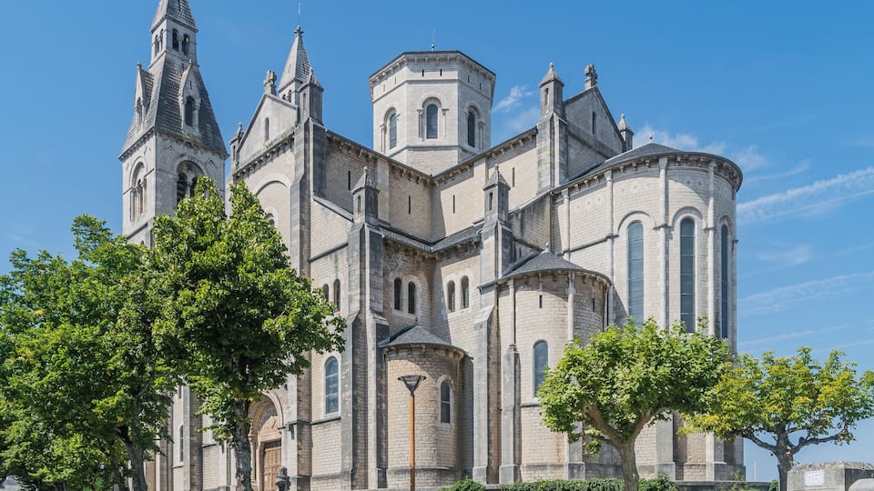 A historic church with multiple towers and arched windows.