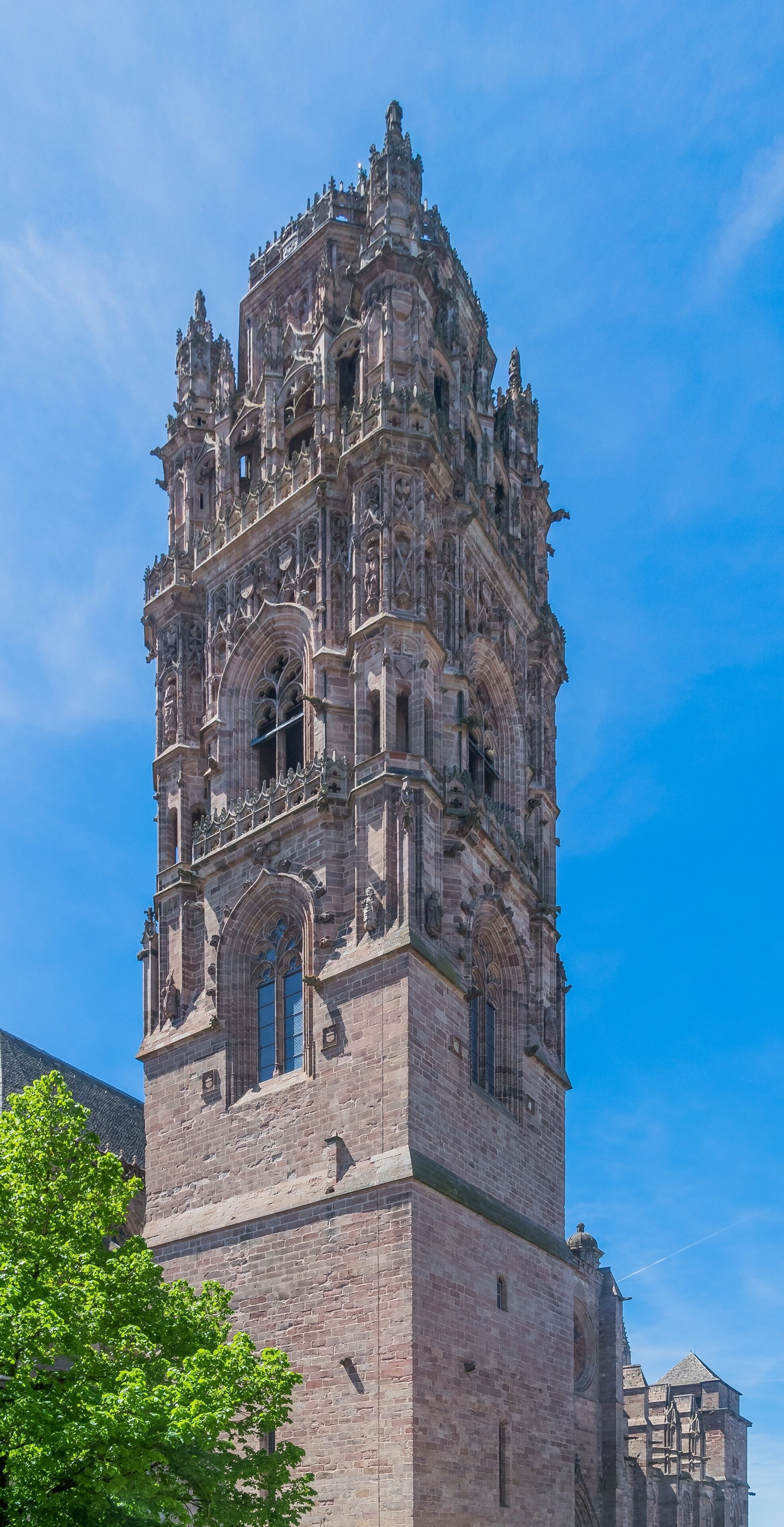 A historic cathedral with intricate Gothic architecture, featuring detailed stone carvings and a prominent bell tower.