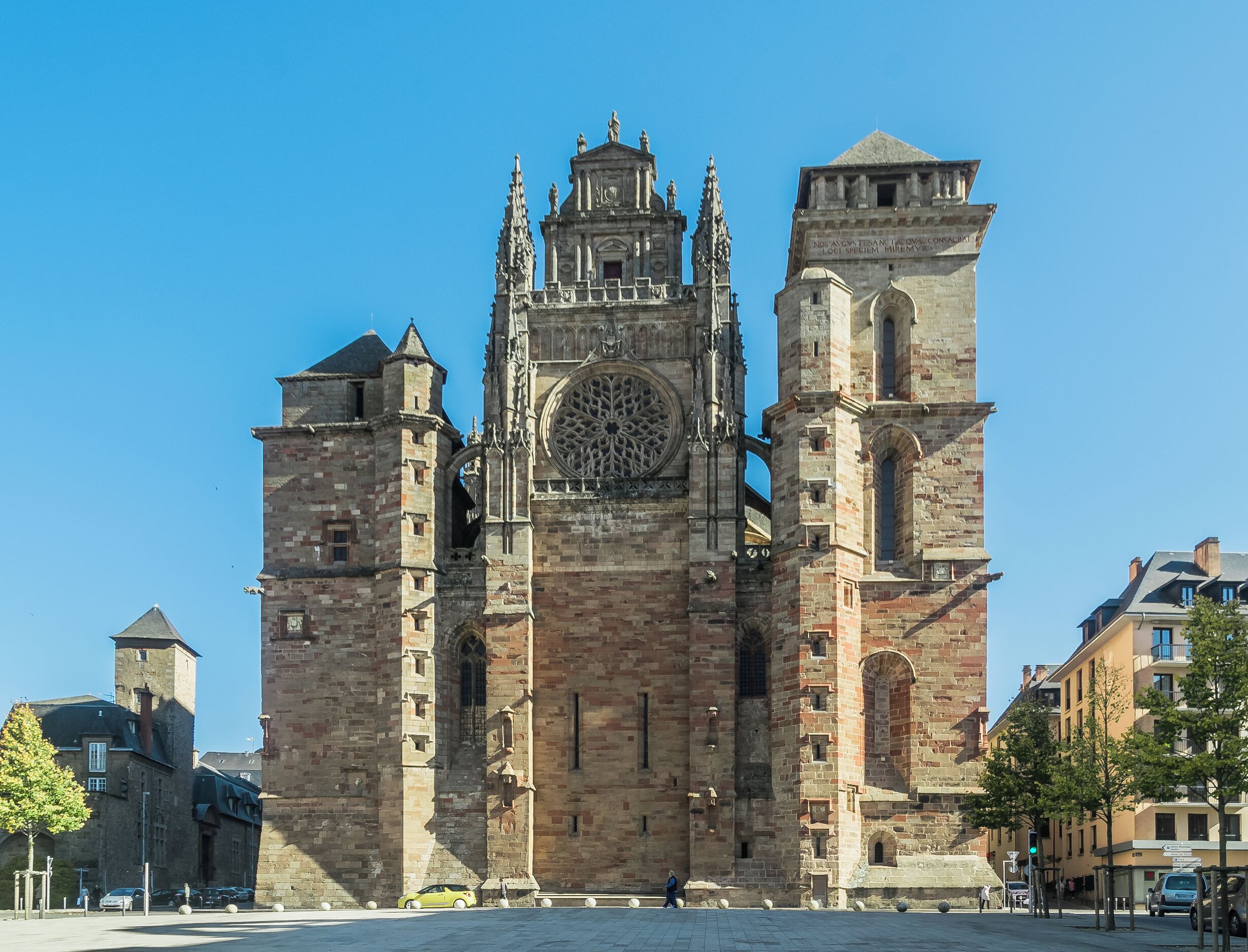 A historic cathedral with a large rose window and twin towers.