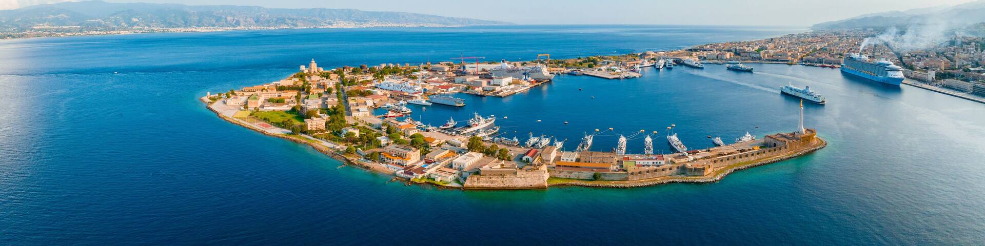 Messina, Sicily, Italy, August 20, 2022. View of the Messina's port with the gold Madonna della Lettera statue