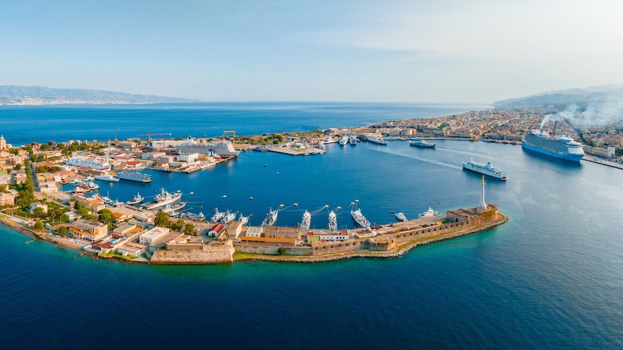 Messina, Sicily, Italy, August 20, 2022. View of the Messina's port with the gold Madonna della Lettera statue