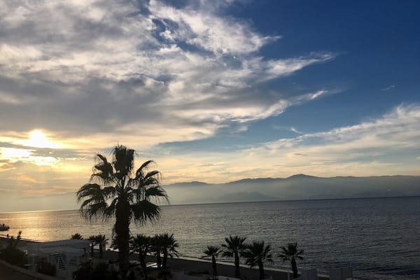 Sicily from Reggio Calabria. With a stunning view of Etna