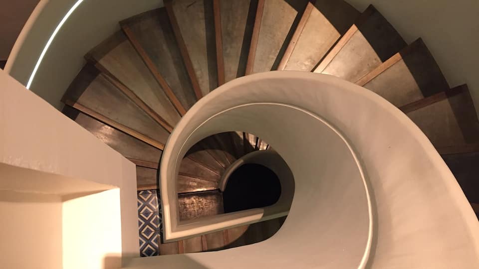 Staircase from the second floor of Viroth’s Hotel in Wat Bo neighborhood of Siem Reap #angkorwat #merch