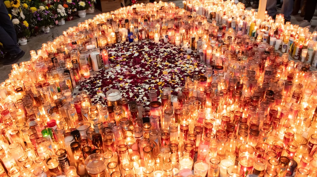 Candles around a heart shaped by rose petals in honor to Virgen de Guadalupe at Iglesia de Guadalupe located in Matamoros, Tamaulipas, México.