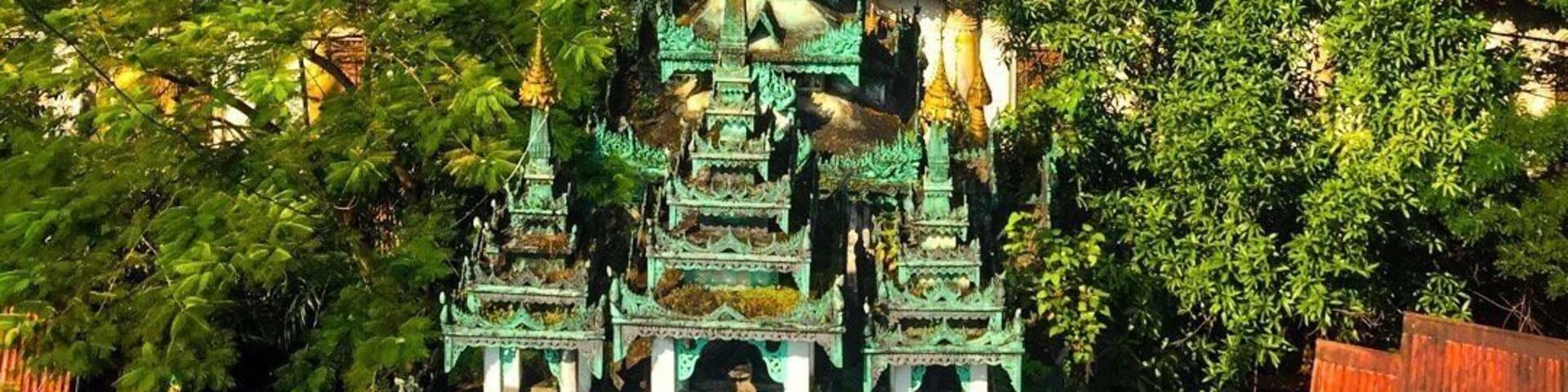 The pagoda with a lot of artwork in the monastery compound , views from the top floor of tower .