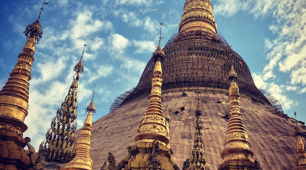 The Shwedagon Pagoda, officially named Shwedagon Zedi Daw and also known as the Great Dagon Pagoda and the Golden Pagoda, is a gilded stupa located in Yangon, Myanmar. This most revered symbol of Buddhism in Myanmar can best be visited in the late afternoon and up to its closing time of 9pm where it is illuminated by spot lights and heightens its majestic appearance. #architecture