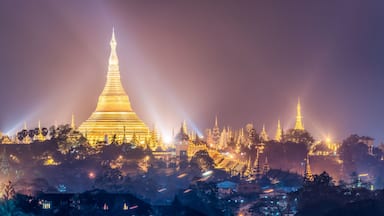 Panoramic view of the golden Shwedagon Pagoda at night, Yangon, Myanmar