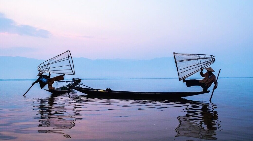 Inle Lake is one of the most beautiful and famous destinations in Myanmar, former Burma. 2 fishermen pose for the photo at sunrise in the middle of the Lake.
#myanmar #blue #southeastasia #inlelake #bestof5